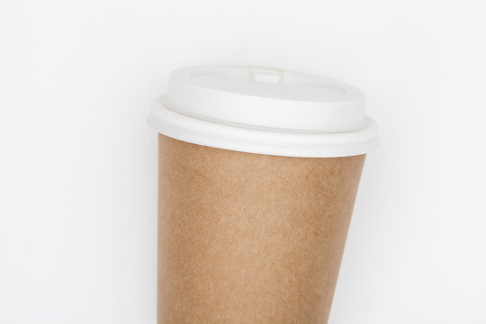 Paper coffee container with white lid on white background. Takeaway drink container. Template of drink cup for your design. Can put text, image, and logo