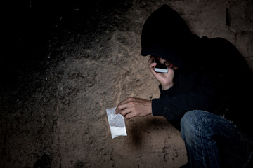 Man call up sells the drugs on phone and he is addicted drug or narcotic with copy space
