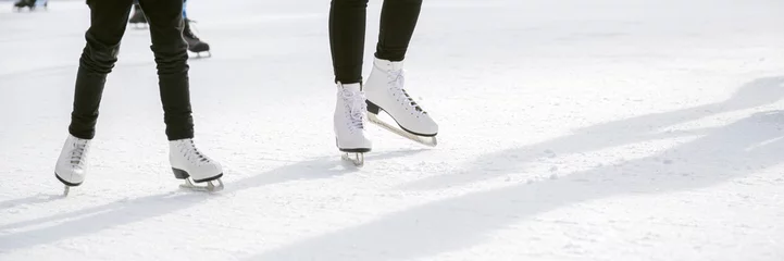 Gordijnen People ice skating on ice rink © Mariusz Blach