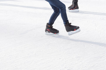 People ice skating on ice rink