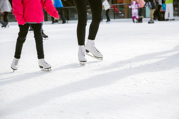 People ice skating on ice rink