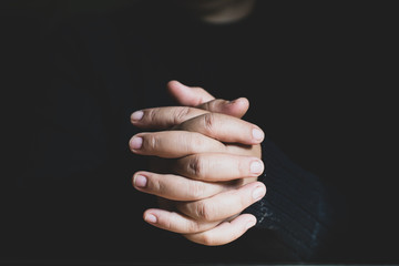 Woman praying on holy bible in the morning. Teenager woman hand with Cross and Bible praying, Hands...