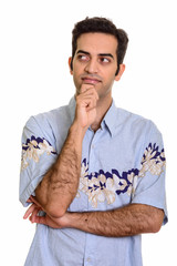 Young Persian man thinking ready for vacation