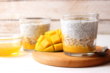 chia pudding with mango, granola and honey. Healthy dessert, proper nutrition, super food.