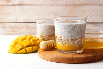 chia pudding with mango, granola and honey. Healthy dessert, proper nutrition, super food.