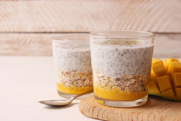 chia pudding with mango, granola and honey. Healthy dessert, proper nutrition, super food.