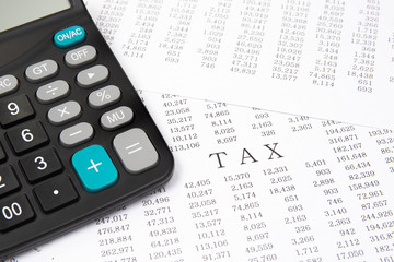 A calculator on financial chart, financial concept.