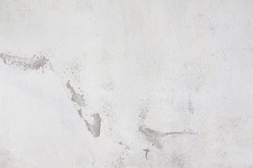 Closeup of peeling white painted wall.