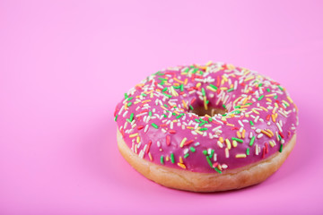 Donut on a pink background.