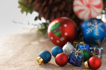 Christmas decoration. New year gifts and christmas tree balls on wooden background