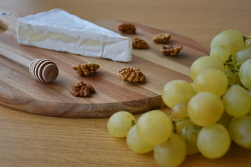 Cheese and grapes on the table