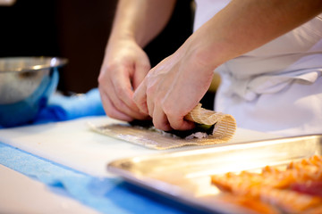 chef hands preparing japanese food, chef making sushi, Preparing Sushi roll