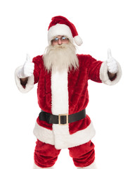 portrait of santa claus with glasses making thumbs up sign