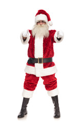merry santa claus pointing fingers while standing with parted feet