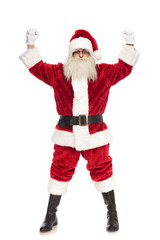 happy santa claus celebrating with fists in the air