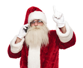 santa claus speaking on the phone points finger up