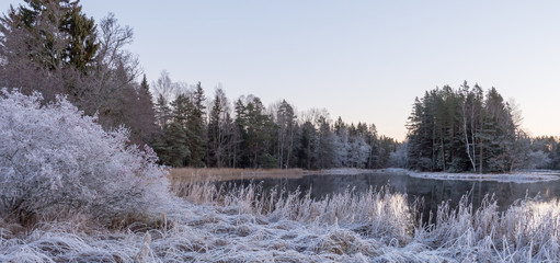 Frosty river landscape in sunrise