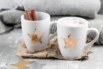 cozy still life with cups and sweaters