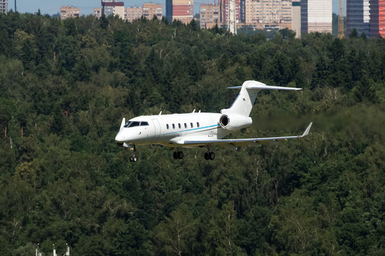 White Modern Private Jet Landing At Airport