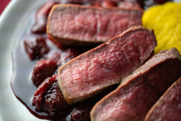 Beef steak with strawberries sauce