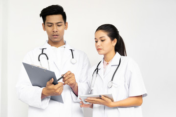 Fototapeta premium Portrait of young man and women asian doctors in white background