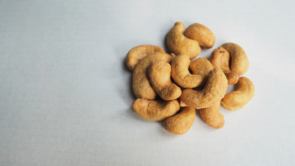 Fototapeta na wymiar Cashew nuts roasted on white background.