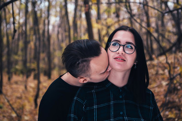 Fototapeta premium young man and woman in the autumn forest