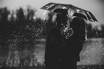 couple under an umbrella in the rain