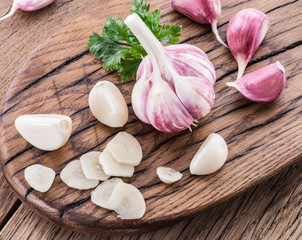 Garlic bulb and garlic cloves  on the wooden table.