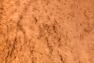 Light brown glossy velvet fabric as background
