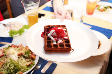 Belgian waffle on a table in a cafe