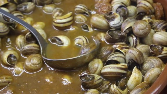 pan with cooked snails on market in the souks of Marrakesh