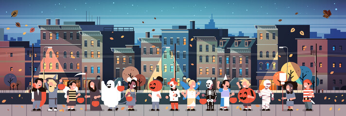 kids wearing monsters costumes walking night town holiday concept cityscape background tricks or treat happy halloween cartoon character full length horizontal banner flat