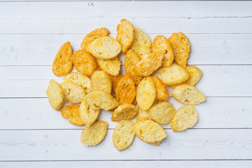 Croutons of white bread baguette with spices in dishes.