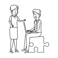 business couple sitting in puzzle piece with laptop