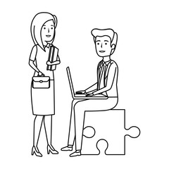 business couple sitting in puzzle piece with laptop