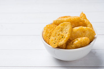 Croutons of white bread baguette with spices in dishes. Copy space