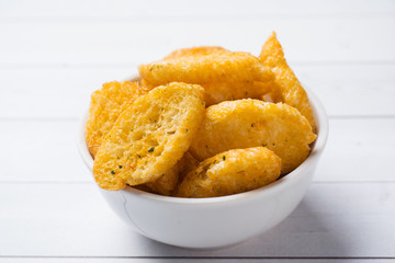 Croutons of white bread baguette with spices in dishes.