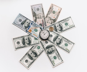 Stopwatch and dollars. Banknotes lie in the shape of a circle around the clock. Time is money concept.Money loan. Credit debt.