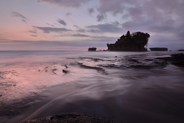 Fototapeta na wymiar Pink sunset at Pura Tanah Lot. Bali. Indonesia