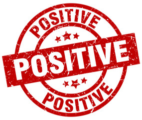 positive round red grunge stamp