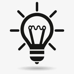 Light bulb idea concept vector icon. Lightbulb with rays glowing icon. Premium quality in trendy style.