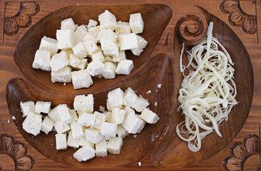 Obraz na płótnie Canvas White brine cheese and yellow kashkaval from cow, goat or sheep milk 