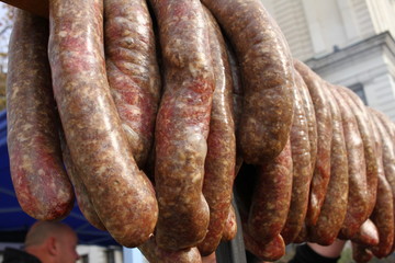 Raw stuffed sausages on a grill