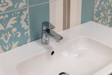 Fototapeta premium Fragment of conventional faucet in the bathroom