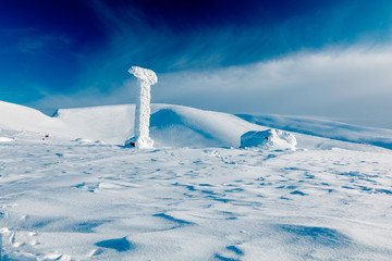 snow covered old cableway support