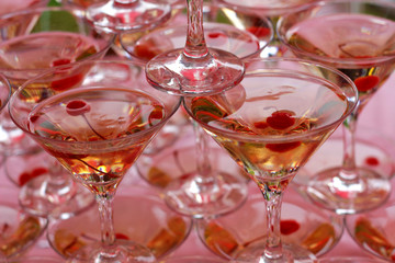 Alcoholic cocktails with champagne and cherry glasses