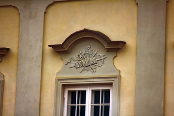 Ancient bas-reliefs on the Windows and walls of historical buildings