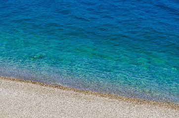 blue sea and pebble beach
