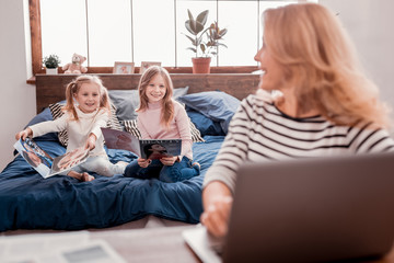 Pleasant kids reading magazines